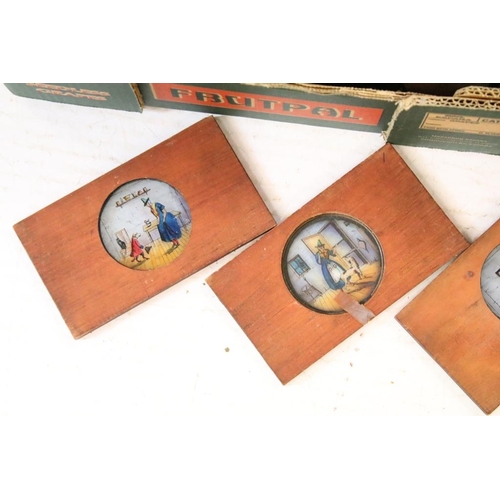 649 - A large collection of wooden framed coloured magic lantern slides to include lever action examples, ... 