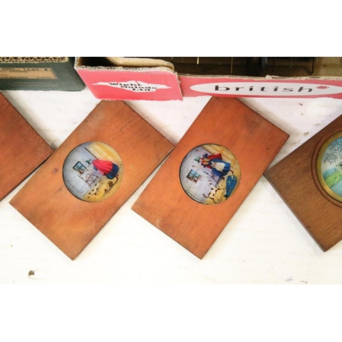 649 - A large collection of wooden framed coloured magic lantern slides to include lever action examples, ... 