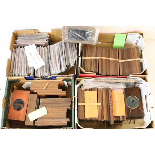 649 - A large collection of wooden framed coloured magic lantern slides to include lever action examples, ... 