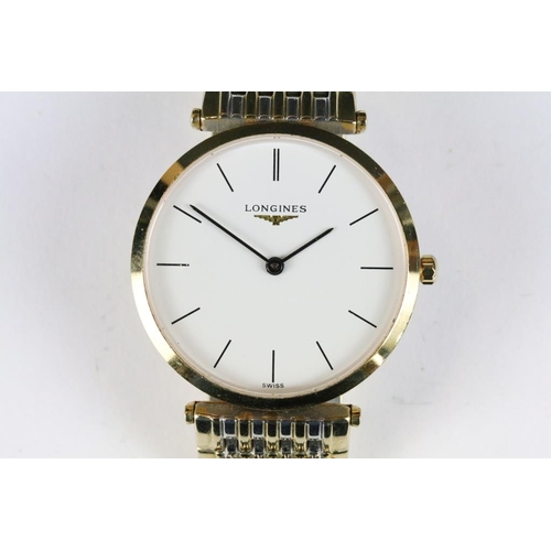 220 - A gents Le Grande Classic De Longines with white enamel dial on original bi metal strap, longings lo... 