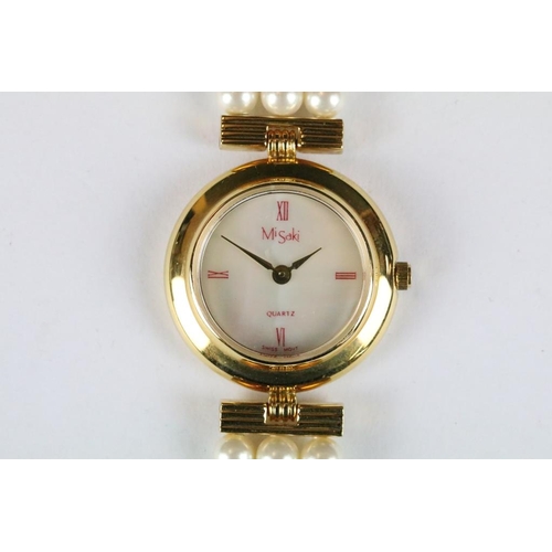 222 - A ladies Misaki Japanese pearl wristwatch with mother of pearl face and pearl strap.