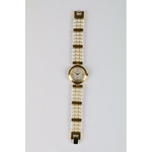 222 - A ladies Misaki Japanese pearl wristwatch with mother of pearl face and pearl strap.