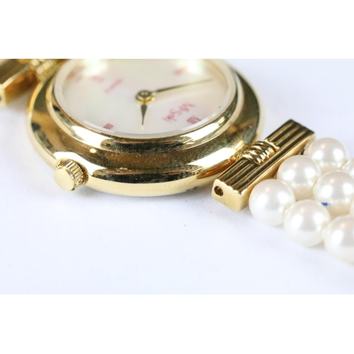 222 - A ladies Misaki Japanese pearl wristwatch with mother of pearl face and pearl strap.