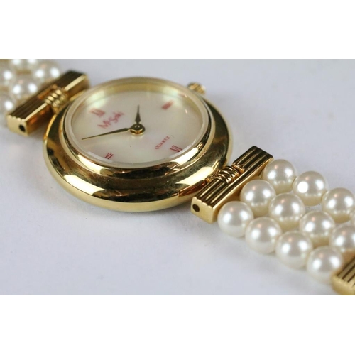 222 - A ladies Misaki Japanese pearl wristwatch with mother of pearl face and pearl strap.