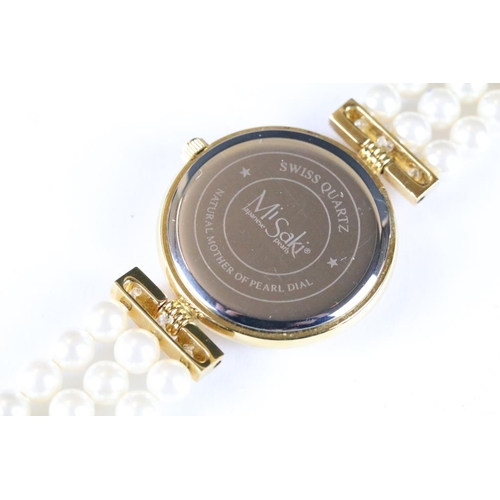 222 - A ladies Misaki Japanese pearl wristwatch with mother of pearl face and pearl strap.