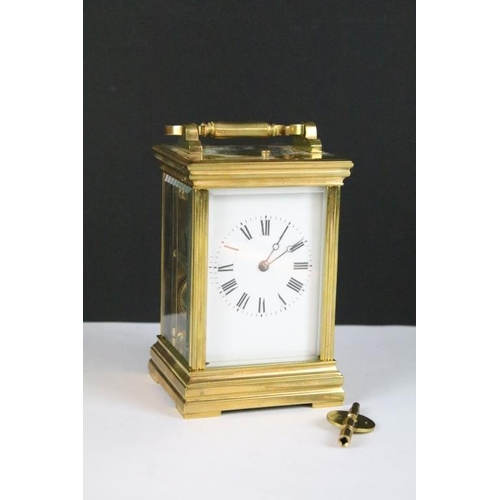 232 - A brass cased carriage clock with bevelled glass panels, with hourly repeater button to the top. App... 