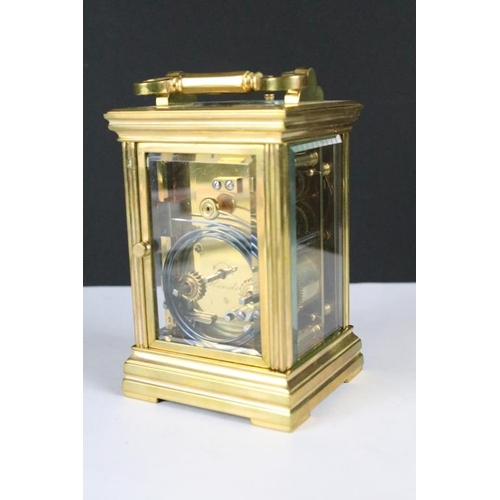 232 - A brass cased carriage clock with bevelled glass panels, with hourly repeater button to the top. App... 