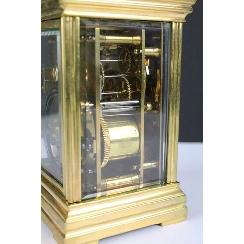 232 - A brass cased carriage clock with bevelled glass panels, with hourly repeater button to the top. App... 