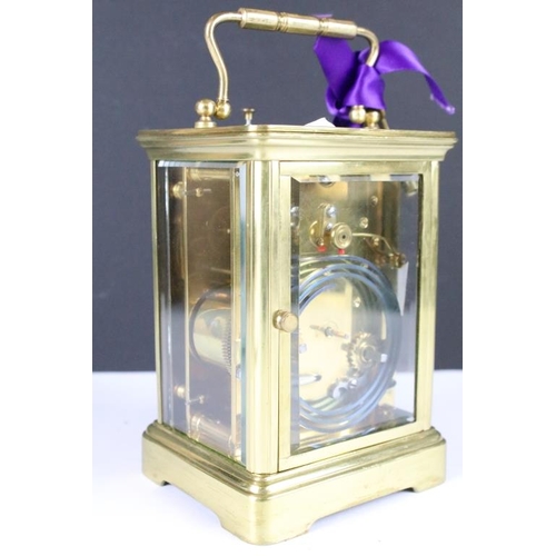 236 - A brass cased carriage clock with bevelled glass panels, retail marked for Joseph Gacph of Gibraltar... 