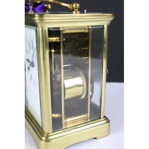 236 - A brass cased carriage clock with bevelled glass panels, retail marked for Joseph Gacph of Gibraltar... 