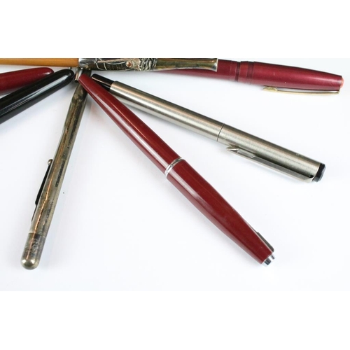 A collection of pens and pencils to include Parker fountain pens and ...