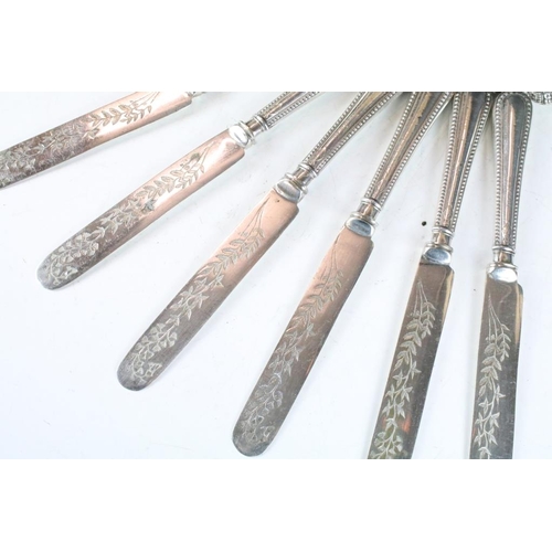 257 - A set of six knives and forks with hallmarked sterling silver handles.