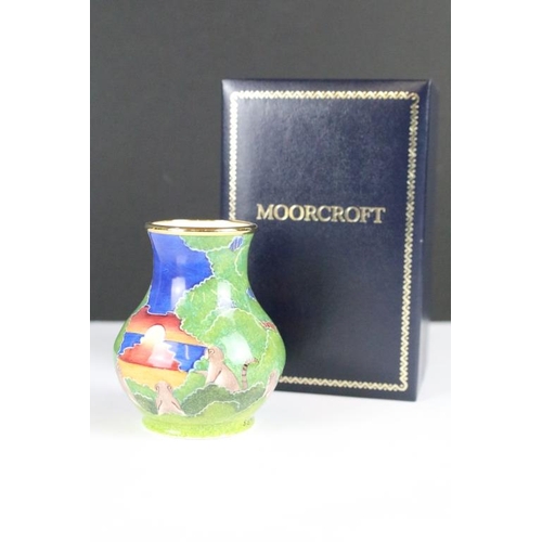 258 - Two miniature Moorcroft vases with enamel decoration, both within fitted display boxes.