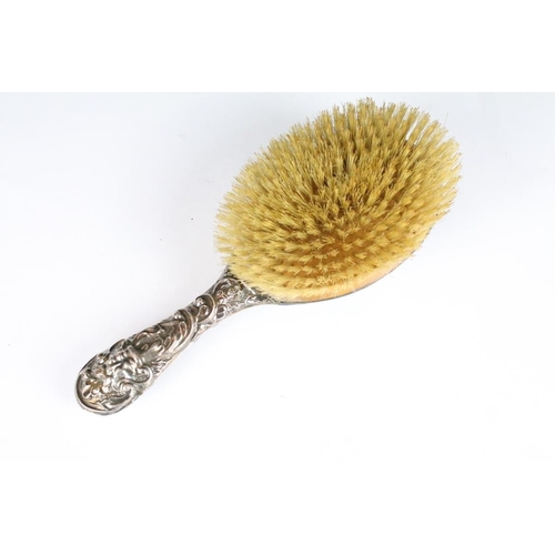 263 - A fully hallmarked sterling silver brush together with a similar hand mirror.