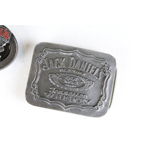 286 - A collection of five pewter belt buckles to include Jack Daniels examples.