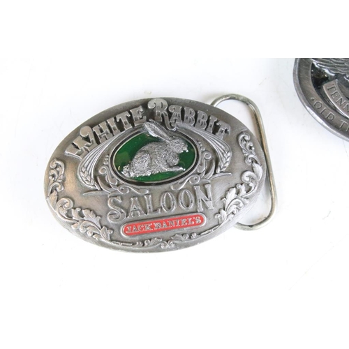 286 - A collection of five pewter belt buckles to include Jack Daniels examples.