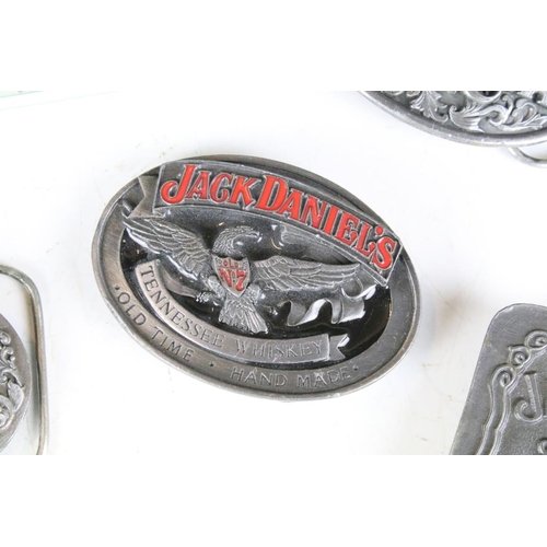 286 - A collection of five pewter belt buckles to include Jack Daniels examples.