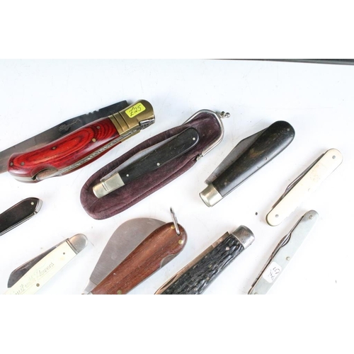 298 - A large collection of penknives to include advertising examples together with multi-tools.