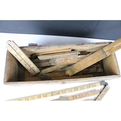 300 - A collection of sixteen vintage wooden folding rulers to include Rabone examples