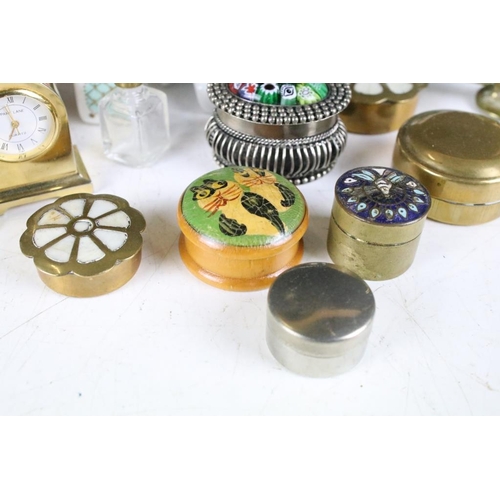 311 - A small collection of trinket boxes together with a snuff bottle, miniature clock, brass figure...et... 