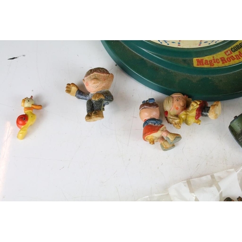 314 - A small collection of vintage toys to include a Corgi Magic Roundabout.