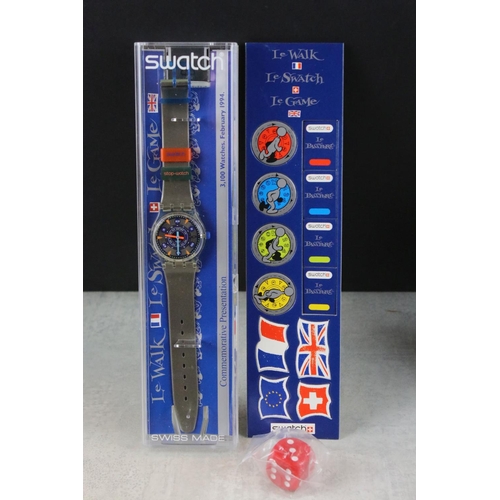 267 - A collection of four Swatch watches to include the Breakfast watch, 100 Years of the Olympic movemen... 