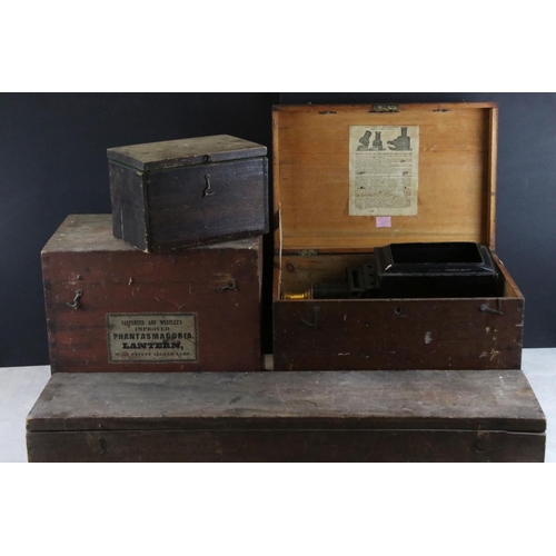 591 - Magic lantern no. 1957 (AF) in a fitted wooden box together with a long slide box and two others.