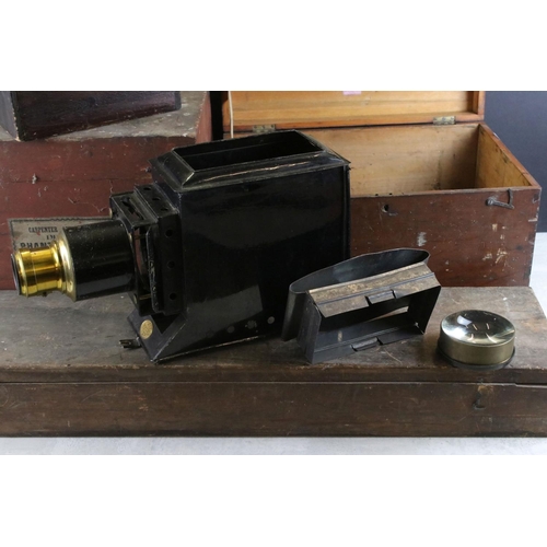 591 - Magic lantern no. 1957 (AF) in a fitted wooden box together with a long slide box and two others.