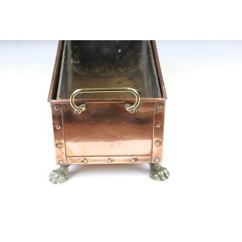 171 - Arts and Crafts Studded Copper Planter with brass loop handles and brass lion paw feet, complete wit... 