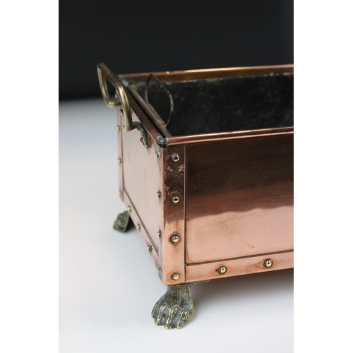 171 - Arts and Crafts Studded Copper Planter with brass loop handles and brass lion paw feet, complete wit... 