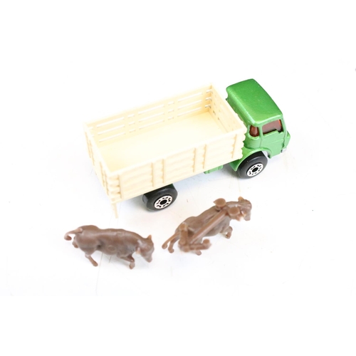 1447 - Ex Shop Stock - 12 Boxed Matchbox 75 Series diecast models to include 35 Zoo Truck ,71 Cattle Truck,... 