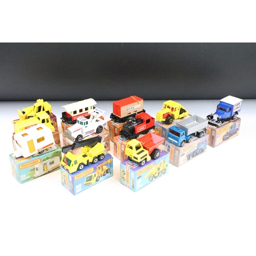 1448 - Ex Shop Stock - 12 boxed Matchbox 75 Series diecast models to include 25 Flat Car/Container, 66 Tyro... 