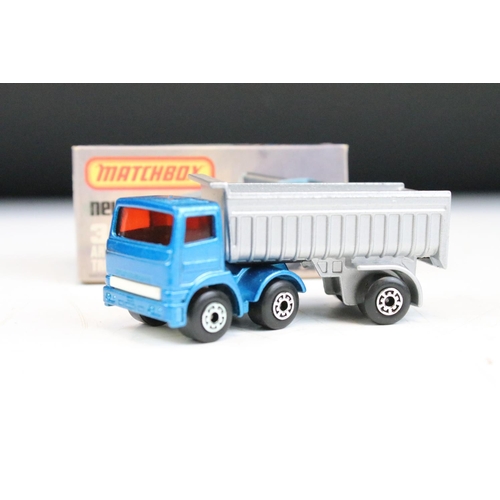 1448 - Ex Shop Stock - 12 boxed Matchbox 75 Series diecast models to include 25 Flat Car/Container, 66 Tyro... 