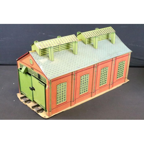 116 - Three Hornby O gauge tin plate trackside buildings to include Station, 2 track engine shed and Crane... 