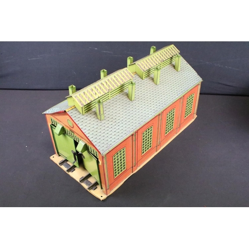 116 - Three Hornby O gauge tin plate trackside buildings to include Station, 2 track engine shed and Crane... 
