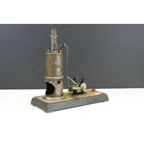 126 - Steam Engine - Unboxed Bing model steam engine plant with vertical chimney on a painted wooden base,... 
