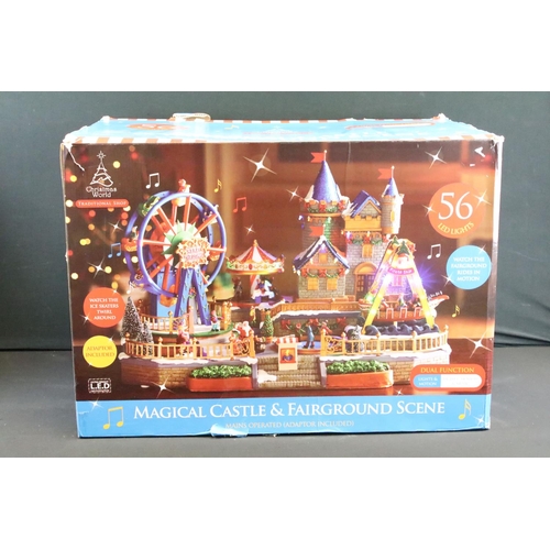 129 - Collection of seven boxed Christmas related buildings/ accessories to include 4 x Lemax fairground e... 