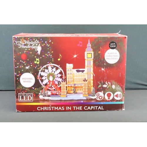 129 - Collection of seven boxed Christmas related buildings/ accessories to include 4 x Lemax fairground e... 