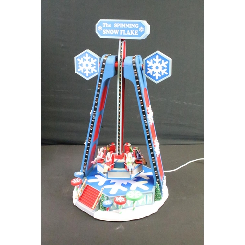 129 - Collection of seven boxed Christmas related buildings/ accessories to include 4 x Lemax fairground e... 