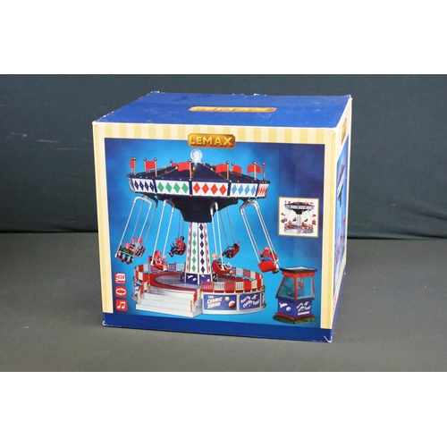 130 - Collection of seven boxed Lemax fairground buildings/ accessories to include Round Up, Circus Funhou... 