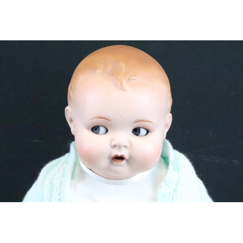 1572 - Seven assorted mid Century baby dolls to include a large baby doll with porcelain head and rotating ... 