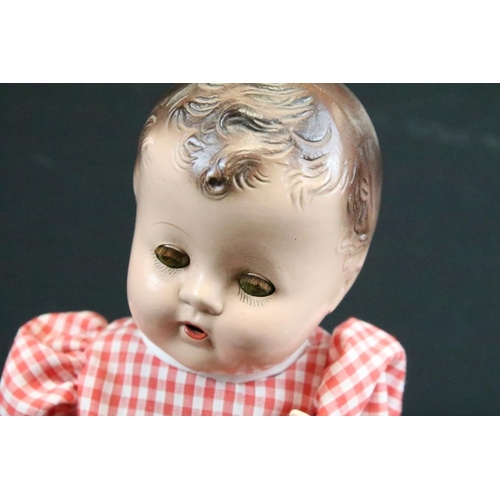 1572 - Seven assorted mid Century baby dolls to include a large baby doll with porcelain head and rotating ... 