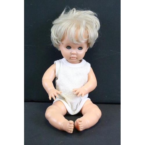 1572 - Seven assorted mid Century baby dolls to include a large baby doll with porcelain head and rotating ... 