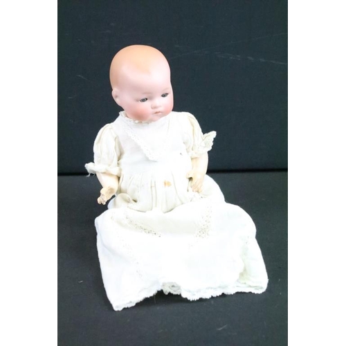 1575 - Group of nine German bisque baby dolls all having hand painted features to the faces and composite b... 