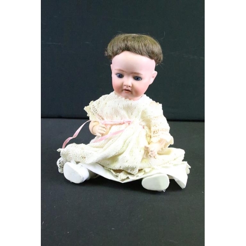 1575 - Group of nine German bisque baby dolls all having hand painted features to the faces and composite b... 