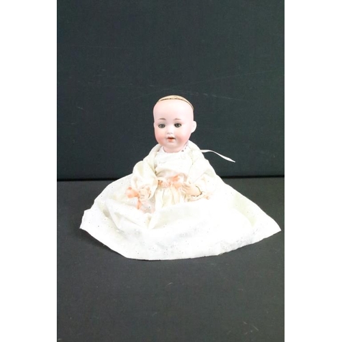 1575 - Group of nine German bisque baby dolls all having hand painted features to the faces and composite b... 