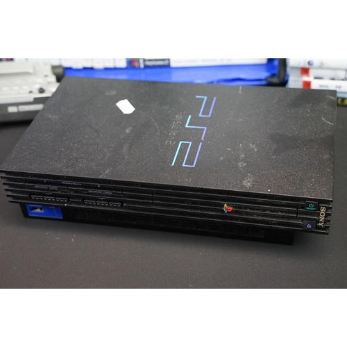 375 - Retro Gaming - A PS2 PlayStation 2 games console with 53 cased PS2 games (Medal Of Honor Rising Sun,... 