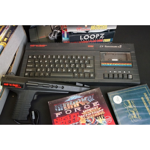 381 - Retro Gaming - A Sinclair 128K ZX Spectrum +2 computer with power supply and gun accessory, together... 