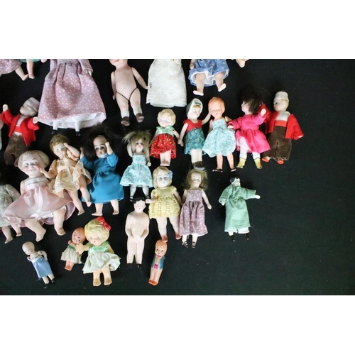 1582 - Collection of small / miniature dolls featuring antique, German, bisque and plastic examples, condit... 