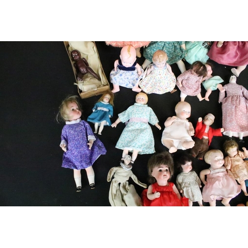 1582 - Collection of small / miniature dolls featuring antique, German, bisque and plastic examples, condit... 